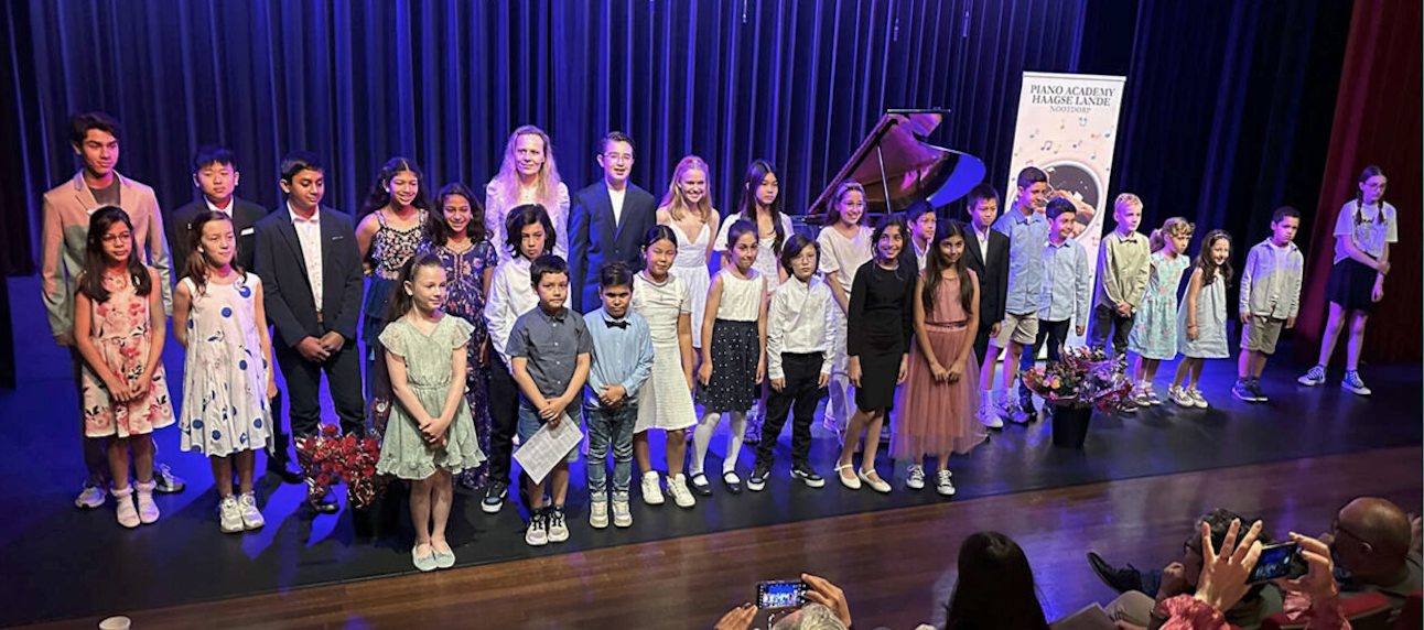 Academy students on stage after a summer concert